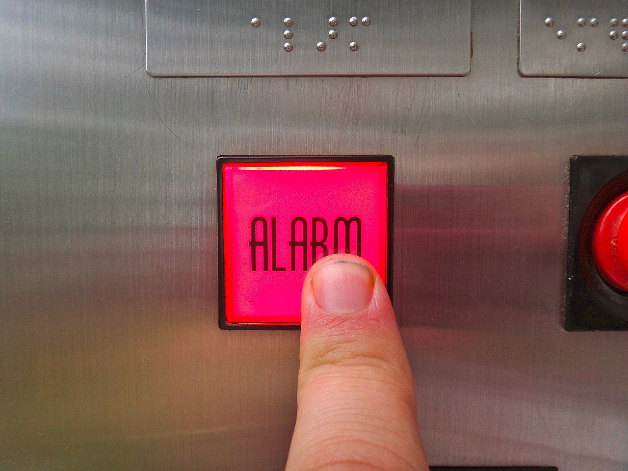 A picture of a lift call button.